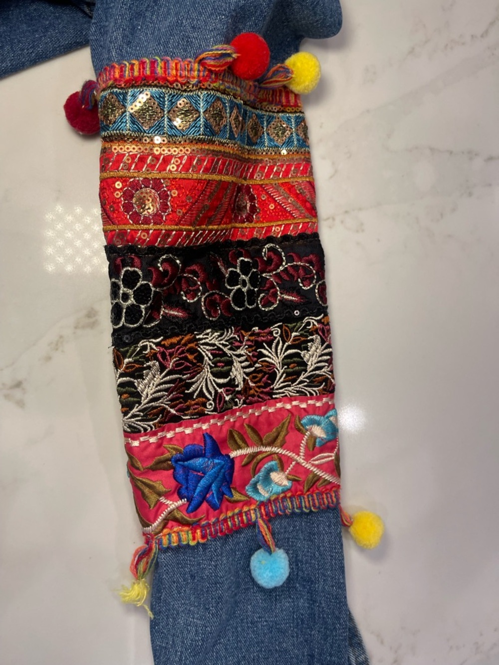 Velzera Women’s Denim Jacket with Multicolor Embroidered Panels and Pom-Poms - Picture 12 of 16